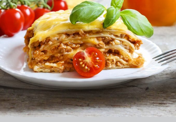 Portion of lasagne with bolognese and cheese