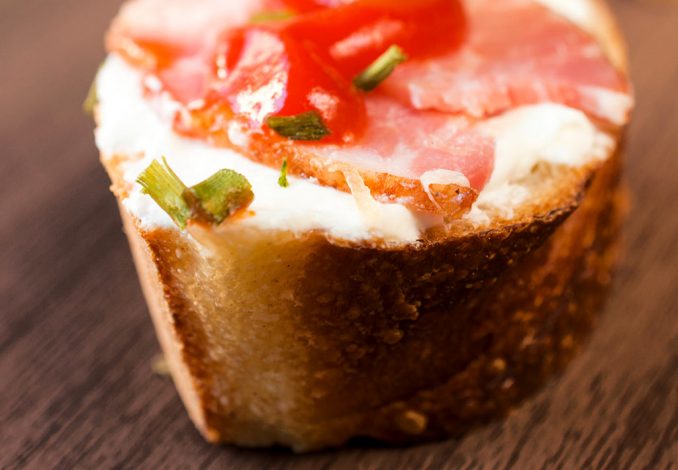 Portion of lasagne with bolognese and cheese